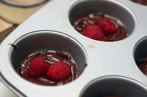 Pouring the batter for the Cognac Chocolate Raspberry Lava Cakes